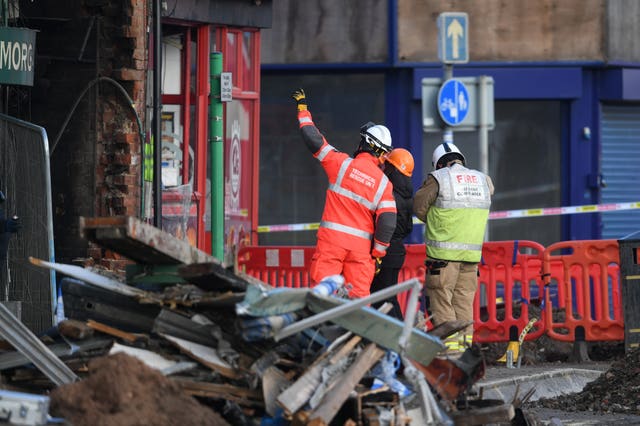 Emergency personnel at the scene (Joe Giddens/PA)