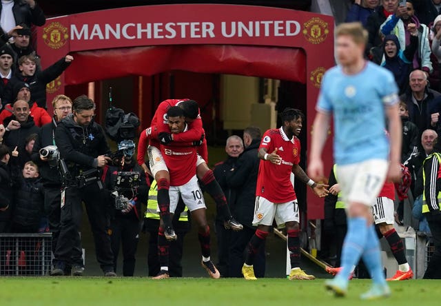 Manchester United’s Marcus Rashford celebrates scoring against Manchester City
