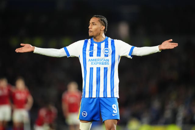 Joao Pedro outstretches his arms to celebrate scoring a goal for Brighton