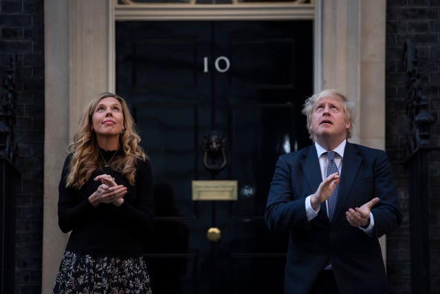 Boris Johnson and his wife, Carrie, stand in Downing Street