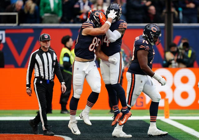 Cole Kmet celebrates scoring a touchdown for the Chicago Bears