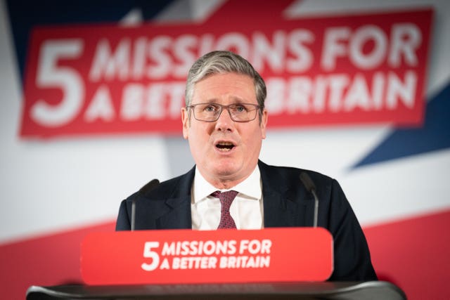 Keir Starmer speaks at a lectern bearing the words "5 missions for a better Britain"