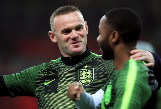 Rooney and Raheem Sterling in conversation during the warm-up