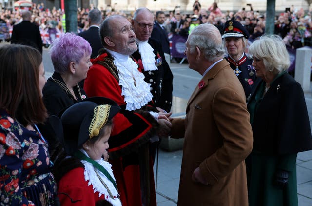 Charles and Camilla are greeted by civic mayor Ian Pearson as they arrive for a ceremony at Mansion House to confer city status on Doncaster