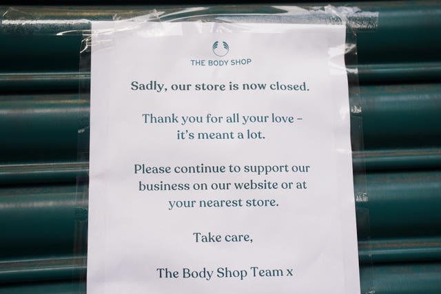 A sign on the shutters at The Body Shop store in Oxford Street, central London