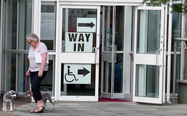 A woman with her dogs at Bannside Presbyterian Church in Banbridge