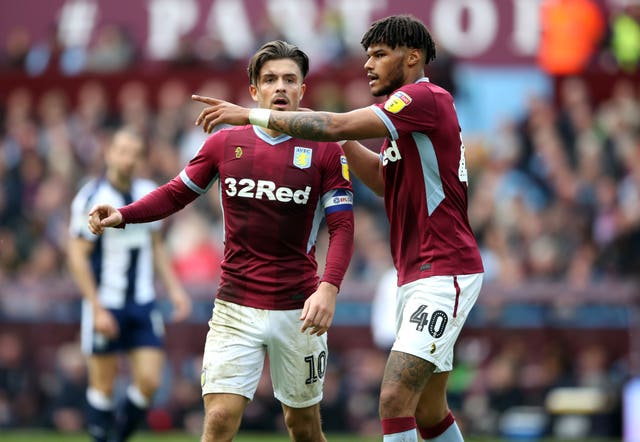 Tyrone Mings speaks to Jack Grealish during the play-off clash at Villa Park