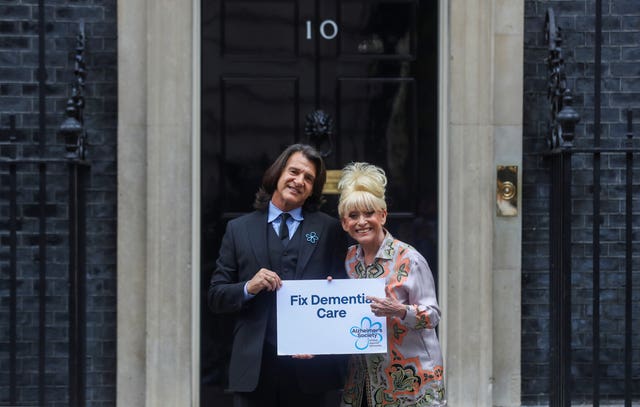 Dame Barbara Windsor and her husband Scott Mitchell deliver an Alzheimer’s Society open letter to 10 Downing Street 