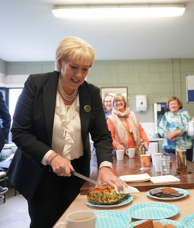 Fine Gael presidential candidate Heather Humphreys cuts a cake at half-time during a visit to a game at Upperchurch Drombane GAA in Tipperary while on the campaign trail