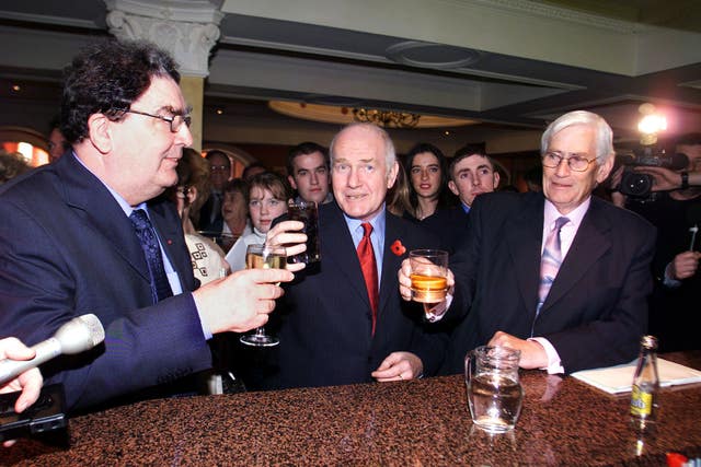 Northern Ireland secretary John Reid (centre) buys John Hume and Seamus Mallon a farewell drink, before Hume’s last speech as SDLP party leader in 2001