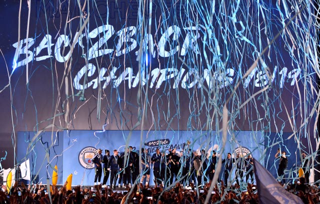 Manchester City’s players and staff celebrate Premier League glory after victory over Brighton