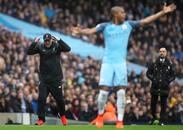 Liverpool manager Jurgen Klopp, left, has enjoyed a fine record against Pep Guardiola