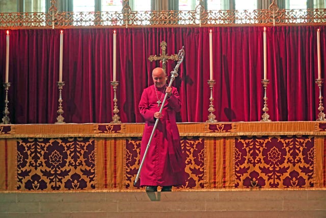 The 98th Archbishop of York, Bishop Stephen Geoffrey Cottrell, takes up the historic Braganza crozier (Peter Byrne/PA)