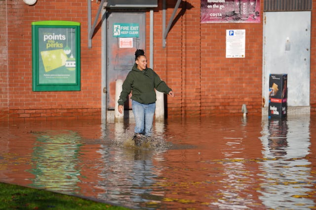 A person walking through a flood