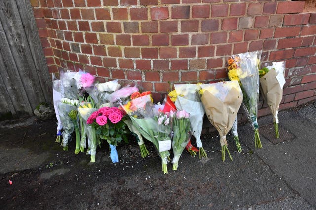 Floral tributes left outside 109 Cowick Lane, Exeter, where the bodies of twins Dick and Roger Carter were discovered 