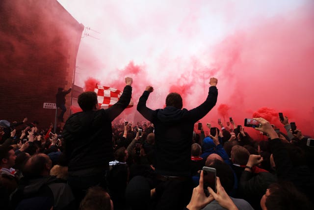 Fans let off flares as the teams arrived for the UEFA Champions League quarter-final at Anfield, Liverpool.