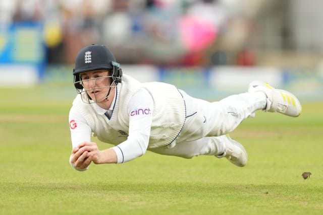Harry Brook takes a fine diving catch to dismiss Mitchell Starc 