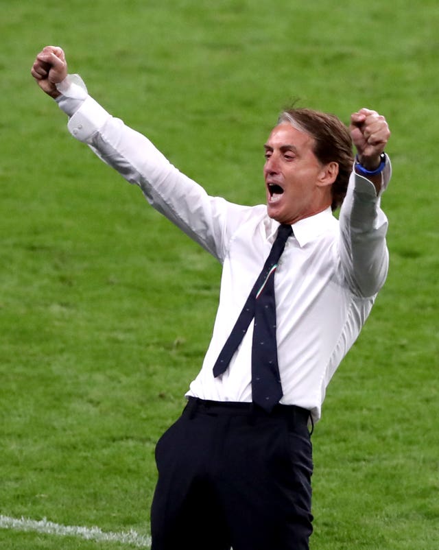 Roberto Mancini celebrates guiding Italy to the Euro 2020 final.