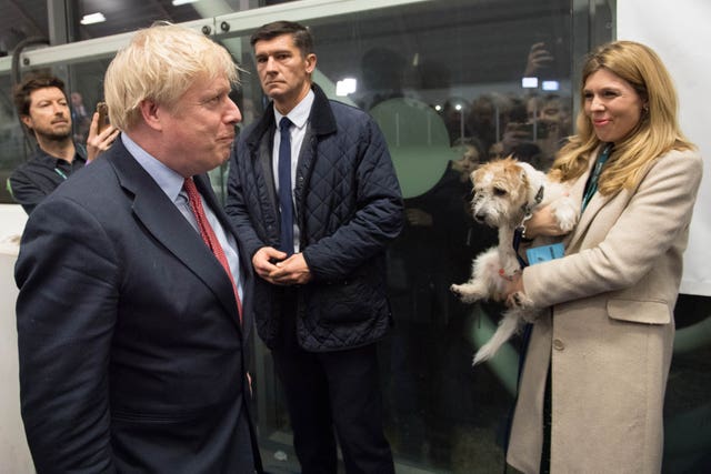 Prime Minister Boris Johnson with partner Carrie Symonds and dog Dilyn at the count for the Uxbridge & Ruislip South constituency (Stefan Rousseau/PA)