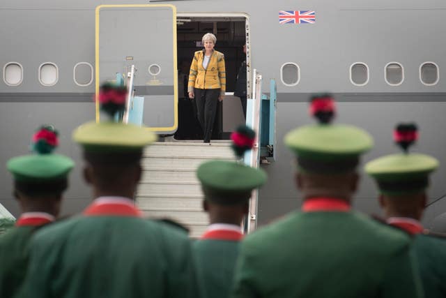 Theresa May lands in Abuja