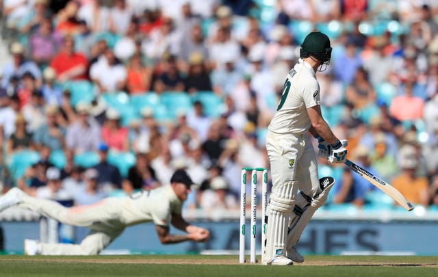 Steve Smith, right, is caught by Ben Stokes