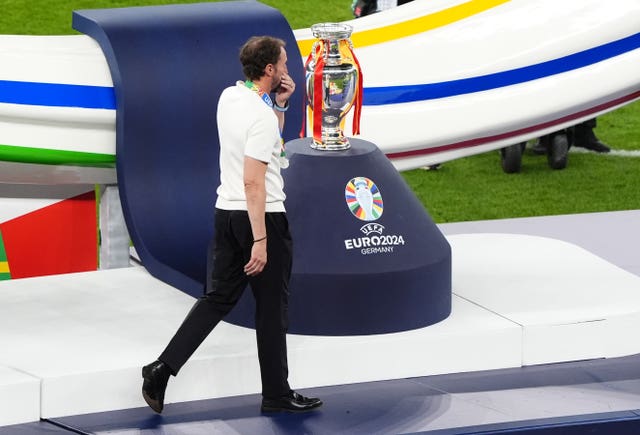 England manager Gareth Southgate walks past the Henri Delaunay Cup