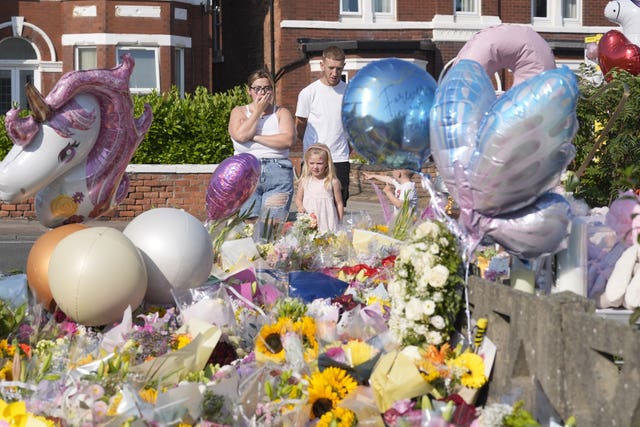 Florals and balloons left as tributes