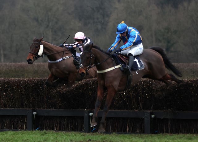 Ben Jones riding The Galloping Bear (right) on their way to winning the racehorselotto.com Surrey National Handicap Chase during day three of The Winter Million Festival at Lingfield Park in 2022 