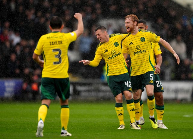 Callum McGregor celebrating his goal with teammates