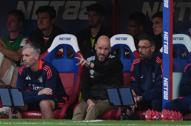 Ruud van Nistelrooy  listens to Erik ten Hag on the bench