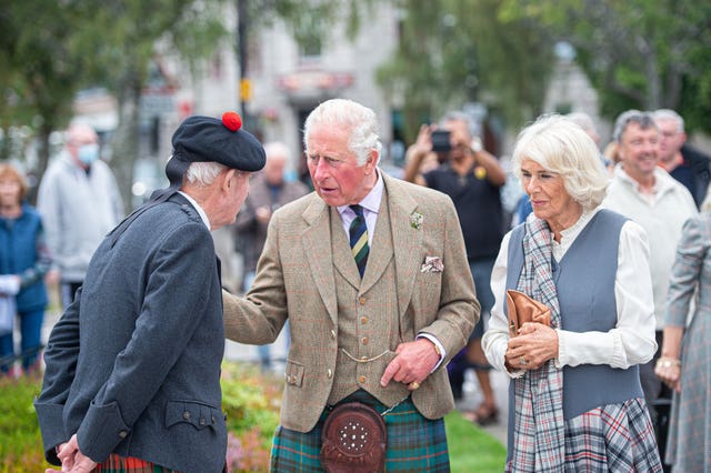 Charles and Camilla on a walk through the village during a visit to the Ballater Community & Heritage Hub in Ballater, Aberdeenshire (Wullie Marr/DCT Media/PA)