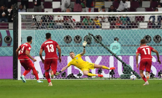 Iran’s Mehdi Taremi beats England goalkeeper Jordan Pickford from the penalty spot 