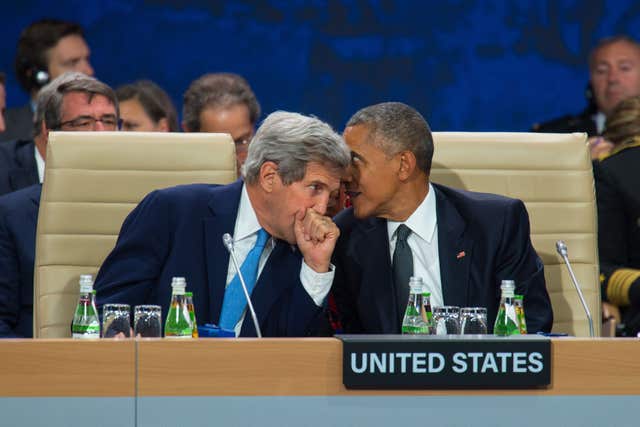 Then US President Barack Obama (right) said the use of chemical weapons would be a red line (Dominic Lipinski/PA)
