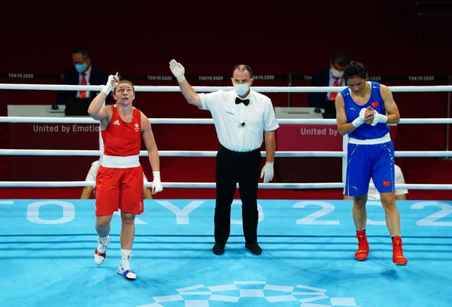 Lauren Price celebrates defeating China's Li Qian to claim Great Britain's final medal of the Olympics in Tokyo