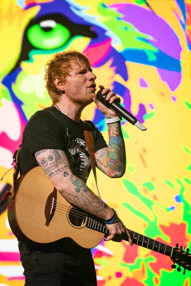 Ed Sheeran performing at a Teenage Cancer Trust Concert in London in 2022