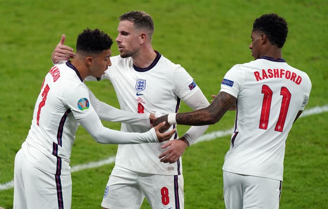 England’s Jadon Sancho, left, and Marcus Rashford, right, suffered racist abuse after missing penalties 