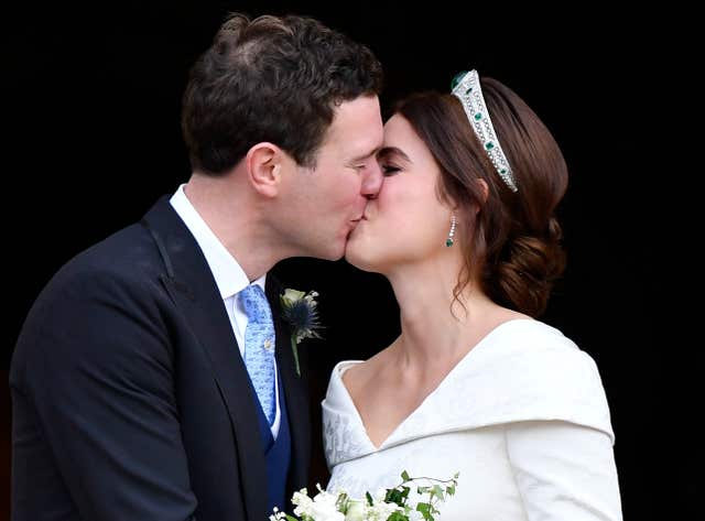 Princess Eugenie and Jack Brooksbank kiss as they leave after their wedding