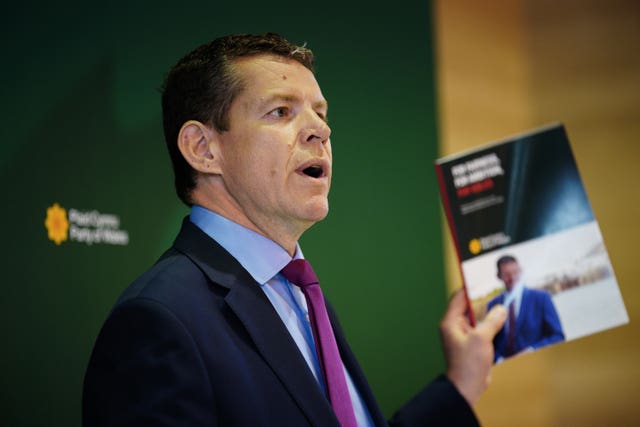 Plaid Cymru leader Rhun ap Iorwerth holds a copy of his party’s General Election manifesto at a launch event in Cardiff