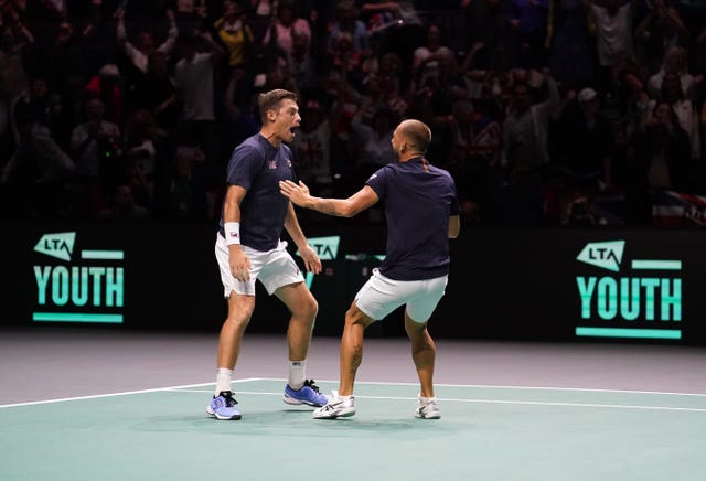 Great Britain’s Neal Skupski, left, and Dan Evans saved four match points in their decisive doubles win against France