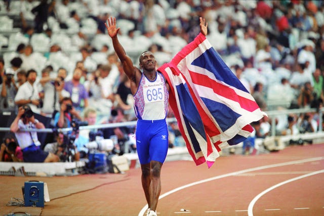 Archive image of Linford Christie celebrating his Olympic gold in Barcelona, waving to the crowd with a Union Jack