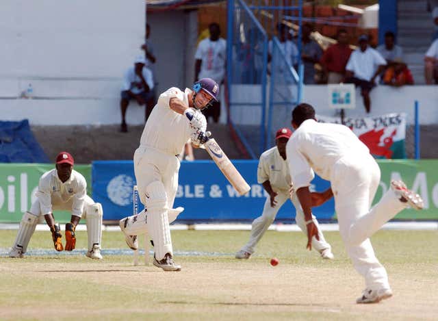 England batter Graham Thorpe (centre) drives the ball for four runs during a Test match against West Indies