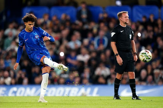 Joao Felix takes a free-kick during Chelsea's game with Barrow 