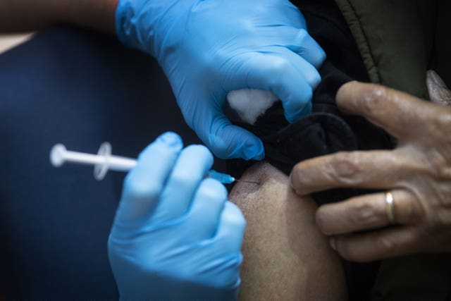 A man receives a Pfizer/BioNTech Covid-19 vaccine jab