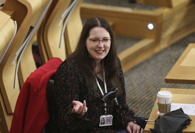 Emma Roddick smiling while seated in the Holyrood chamber