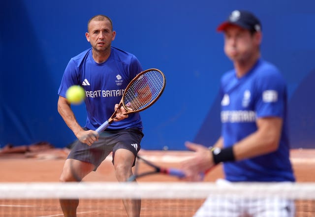 Dan Evans, left, and Andy Murray during practice