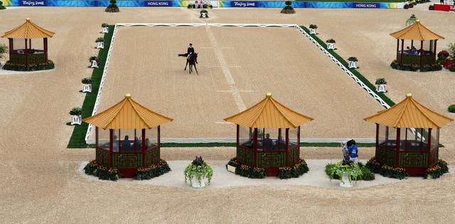 A horse takes part in the Beijing Olympics dressage test at the Shatin Equestrian centre in Hong Kong