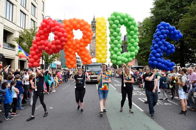 Balloons spell out pride during the parade 