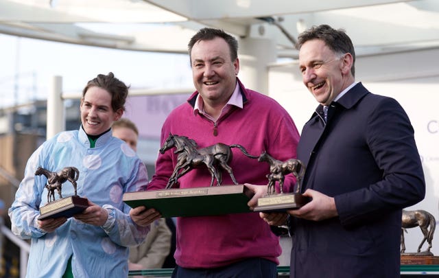 Kenny Alexander flanked by Rachael Blackmore and Henry de Bromhead on the winner's rostrum