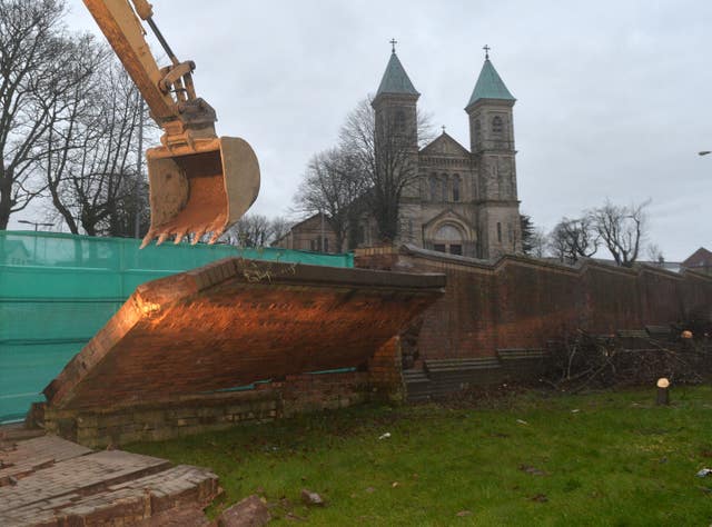 A peace wall at the top of the Crumlin Road in Belfast opposite Holy Cross Church in 2016 being demolished