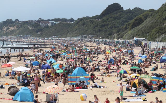 Crowds on Bournemouth beach during the warm weather this summer 